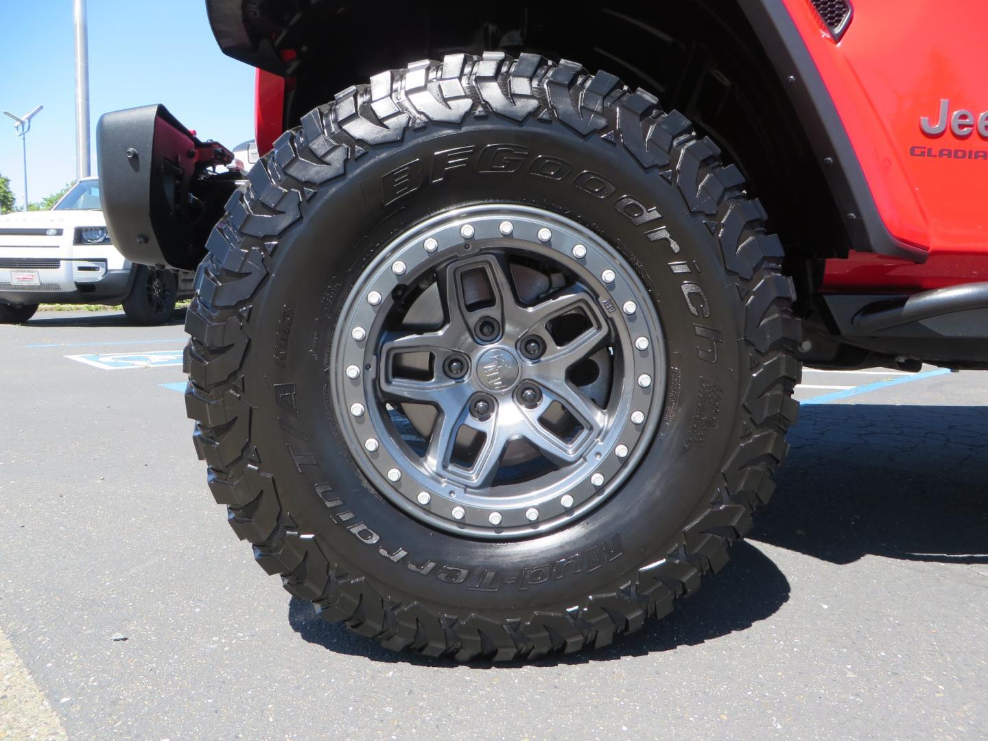 2020 Red /black Jeep Gladiator Rubicon (1C6JJTBG6LL) with an 3.6L V6 DOHC 24V engine, 6M transmission, located at 2630 Grass Valley Highway, Auburn, CA, 95603, (530) 508-5100, 38.937893, -121.095482 - Rubicon Gladiator featuring a Mopar suspension system with Fox shocks, 17" AEV wheels wrapped in 37" BFG tires, Warn Winch, Rock sliders, Cascade front license plate holder, Impact bedliner, Built Right Industries bed Molle panels, and Window tint. - Photo#8